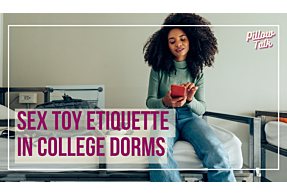 Black woman with natural, curly hair, and green sweater is sitting on top bunk of dorm bed, texting and smiling. A white frame surrounds image, text in magenta “Sex Toy Etiquette in College Dorm Rooms" in magenta cursive is in upper right corner.