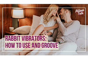 White, heterosexual couple in neutral clothes sit on bed facing each other. Man (RIGHT) boops the nose of woman (LEFT). A white frame surrounds image, text in magenta “Rabbit Vibrators: How to Use and Groove" in magenta cursive is in upper right corner.